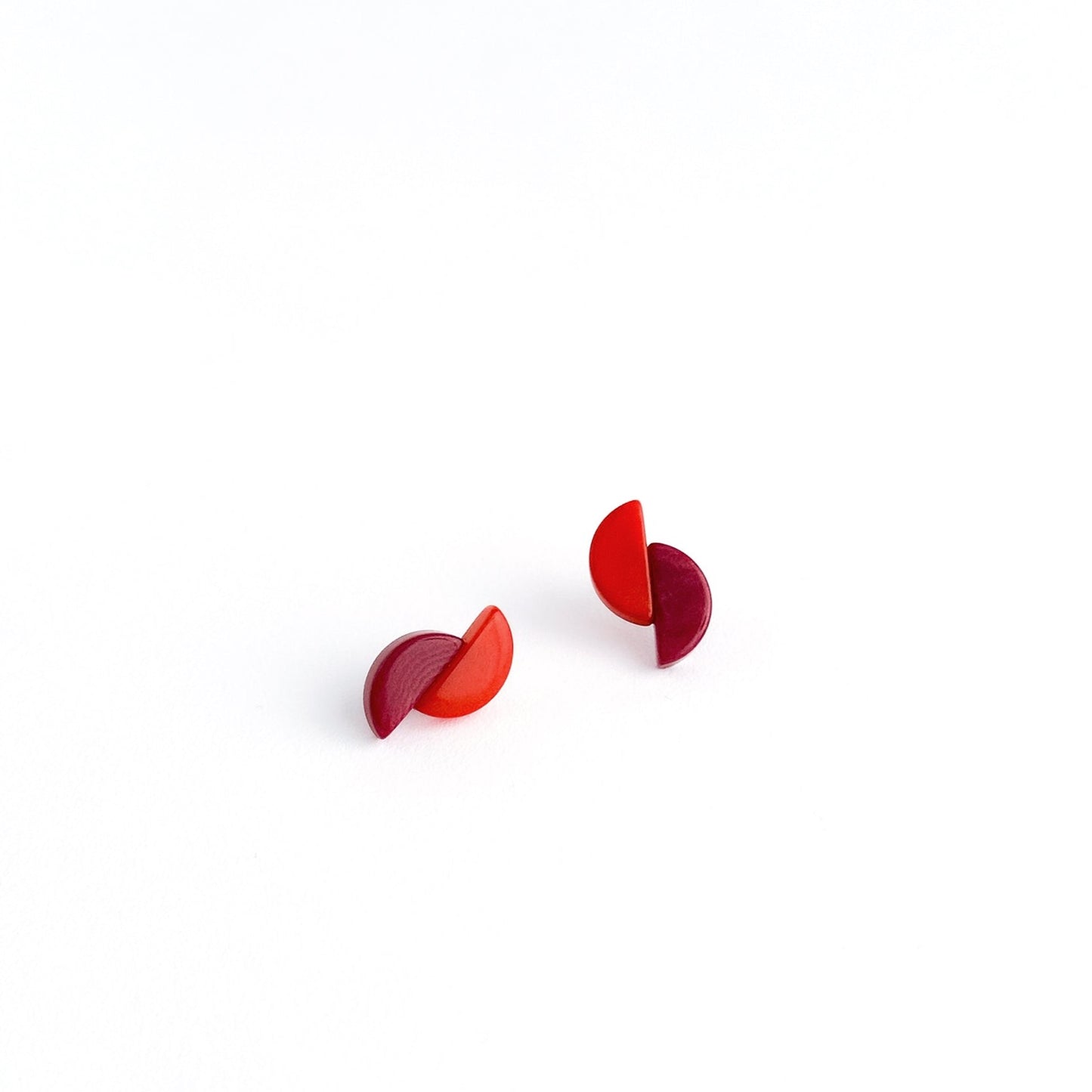 Asymmetric and contrasting colour earring studs made with handmade tagua nut beads