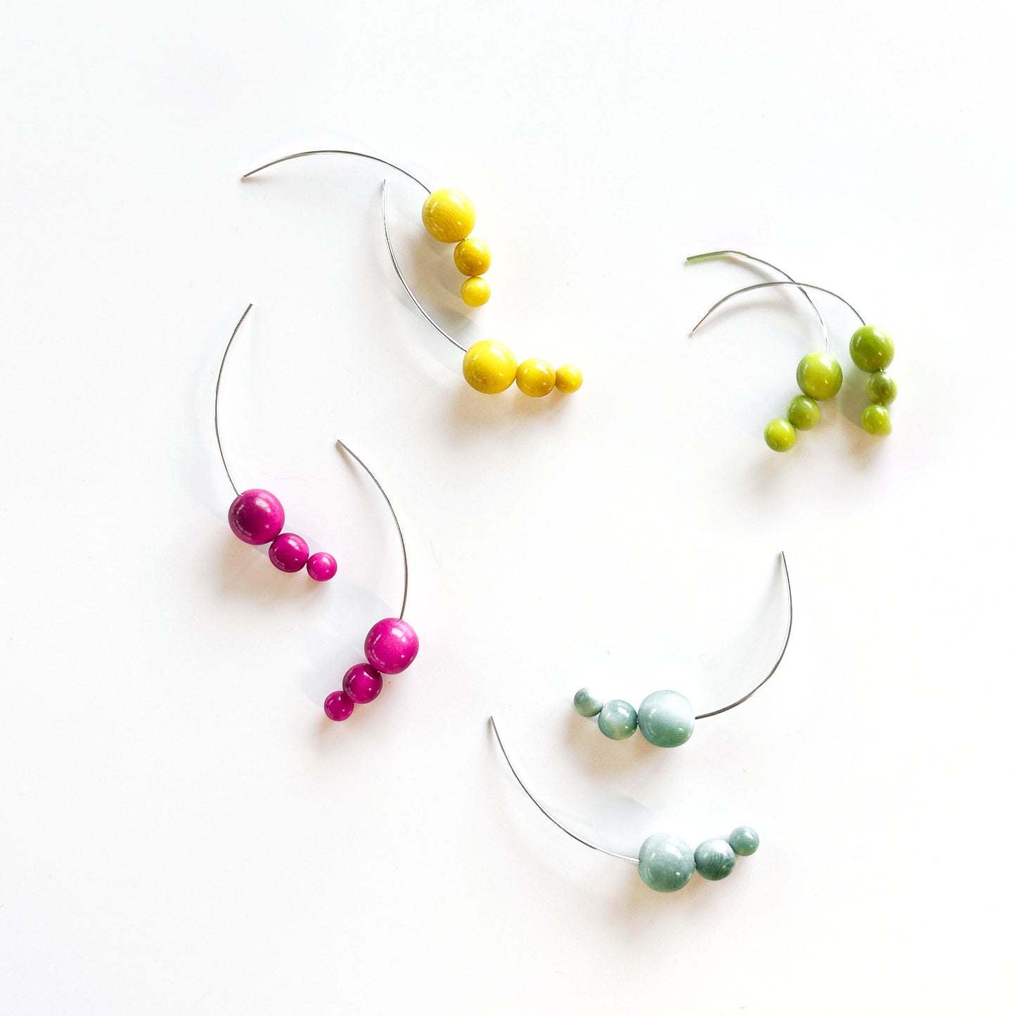 Handmade sterling silver hook earrings with organic tagua nut beads