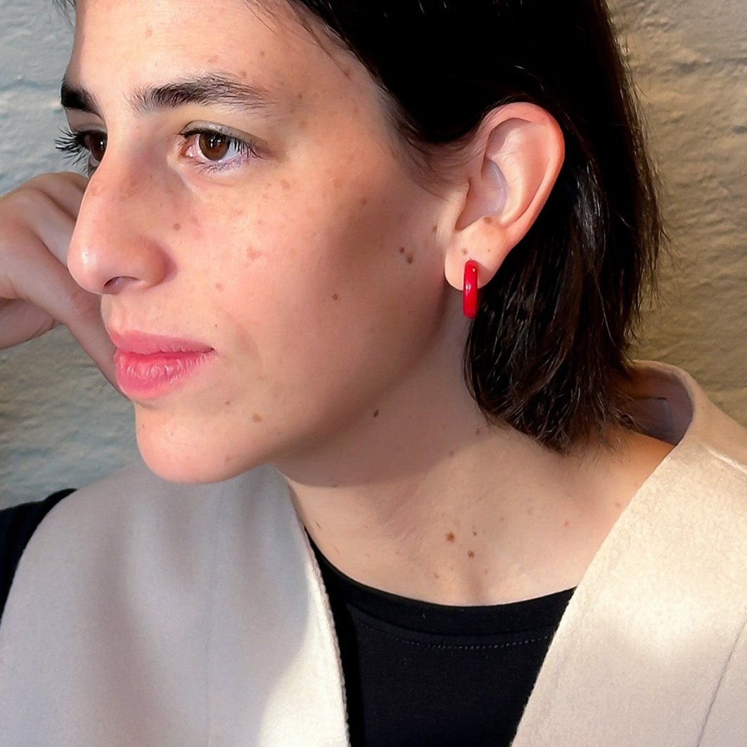 Model wearing Mini hoops handmade with tagua nut beads