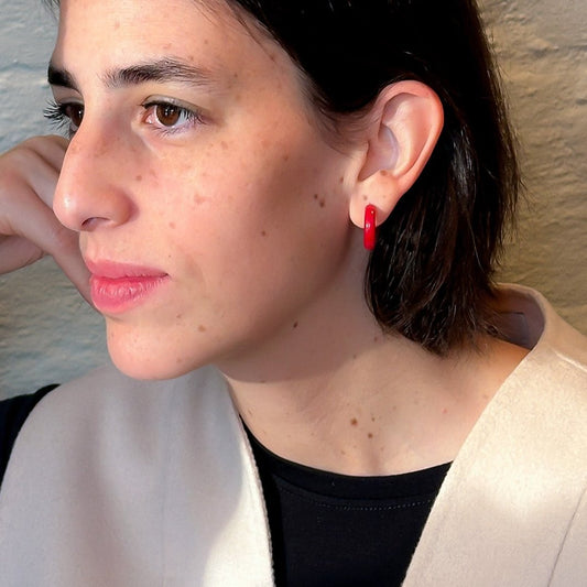 Model wearing Mini hoops handmade with tagua nut beads