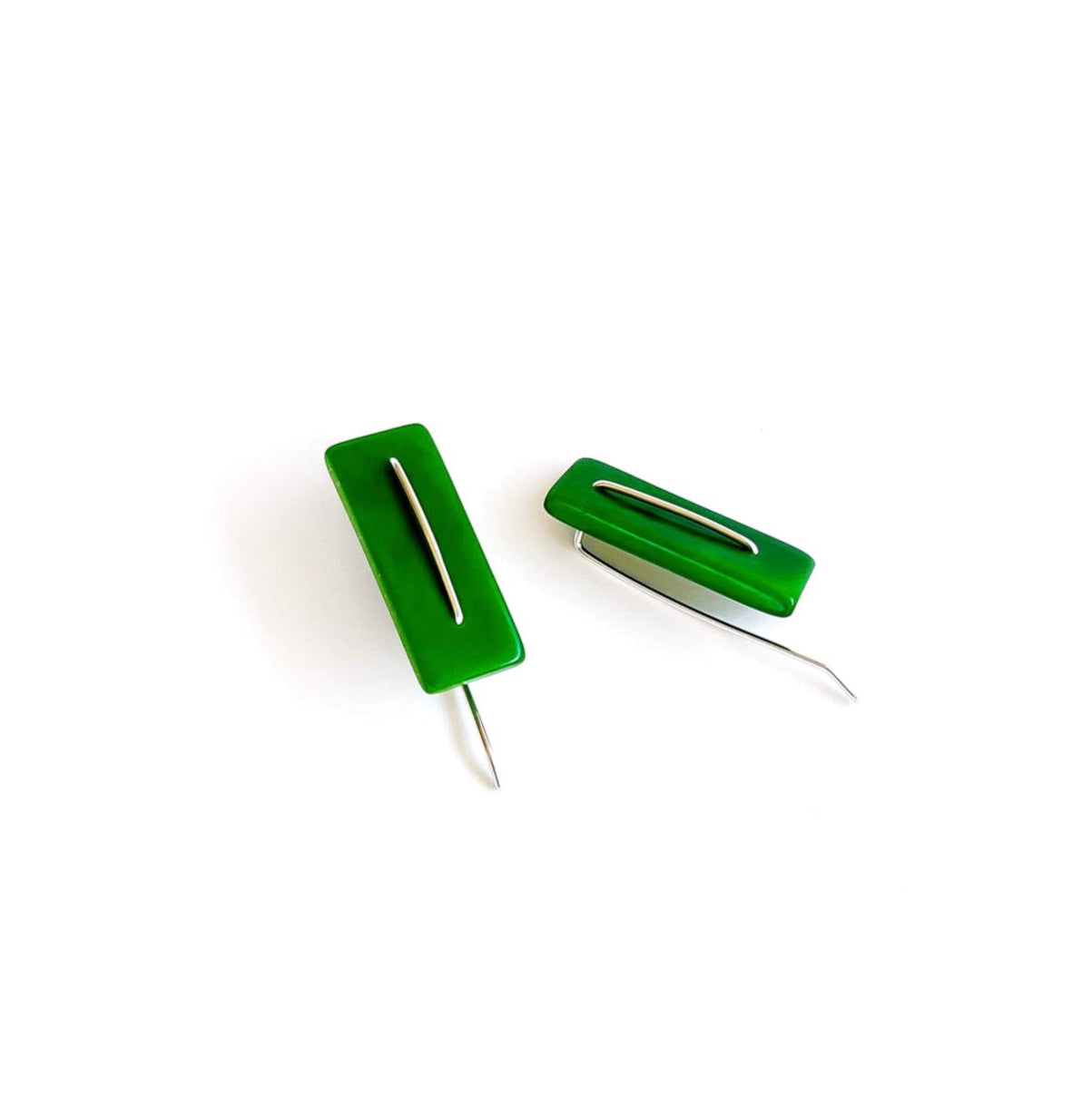 Modern laser cut tagua earrings with a handmade sterling silver hook which is attached without the use of glue.
