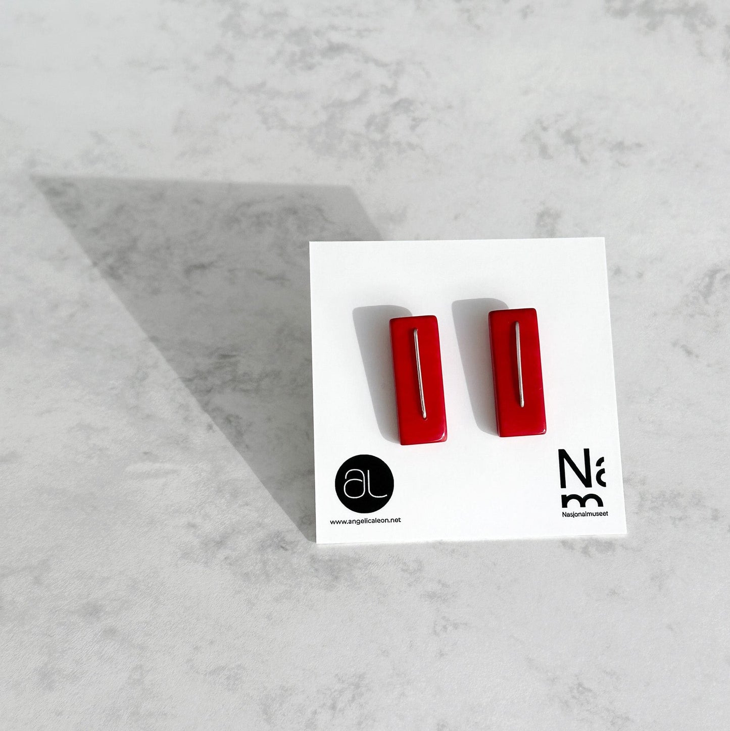 Modern laser cut tagua earrings with a handmade sterling silver hook which is attached without the use of glue.