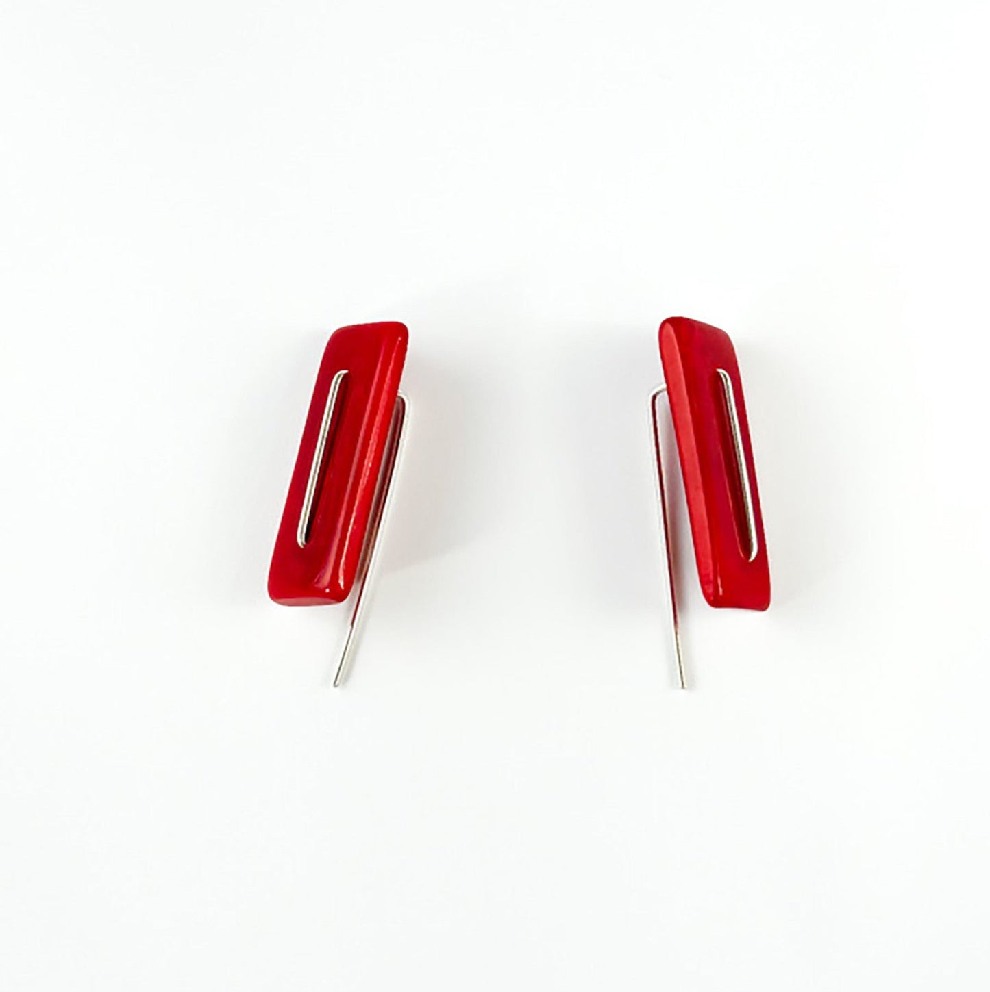 Modern laser cut tagua earrings with a handmade sterling silver hook which is attached without the use of glue.