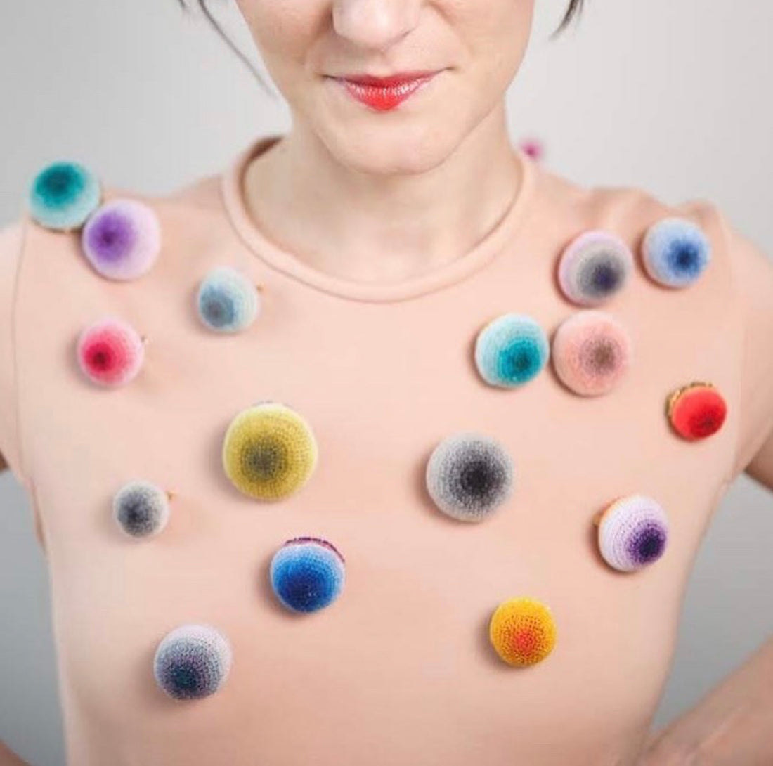 Designer Ruta Naujalyte wearing her hand crocheted broaches