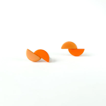 Asymmetric and contrasting colour earring studs made with handmade tagua nut beads