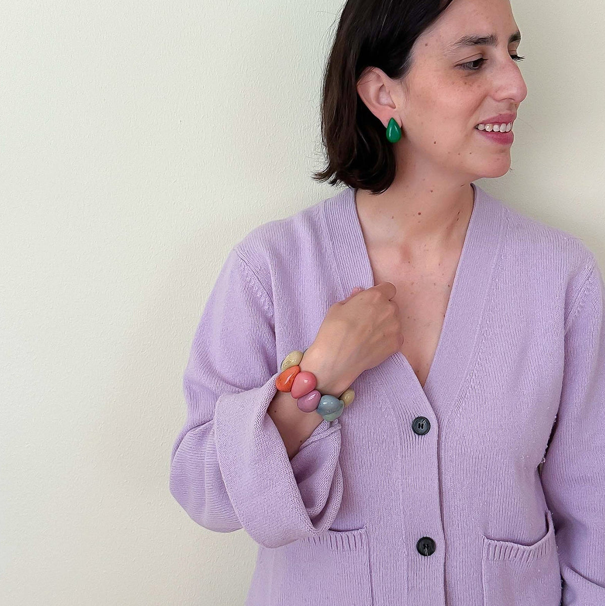 Model wearing Tagua nut drop shaped earrings and bracelet