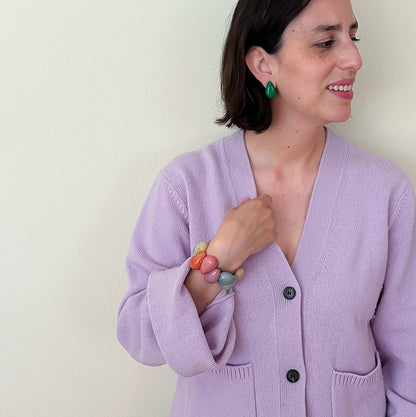 Model wearing Tagua nut drop shaped earrings and bracelet