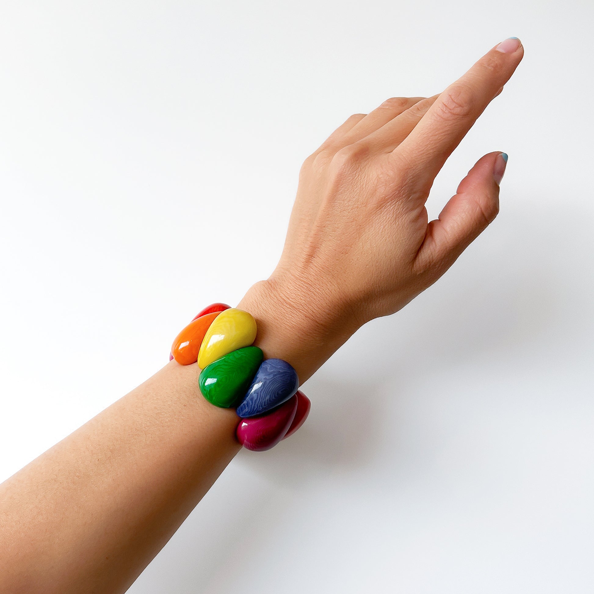 Wrist with rainbow colour bracelet hand made with tagua nut beads