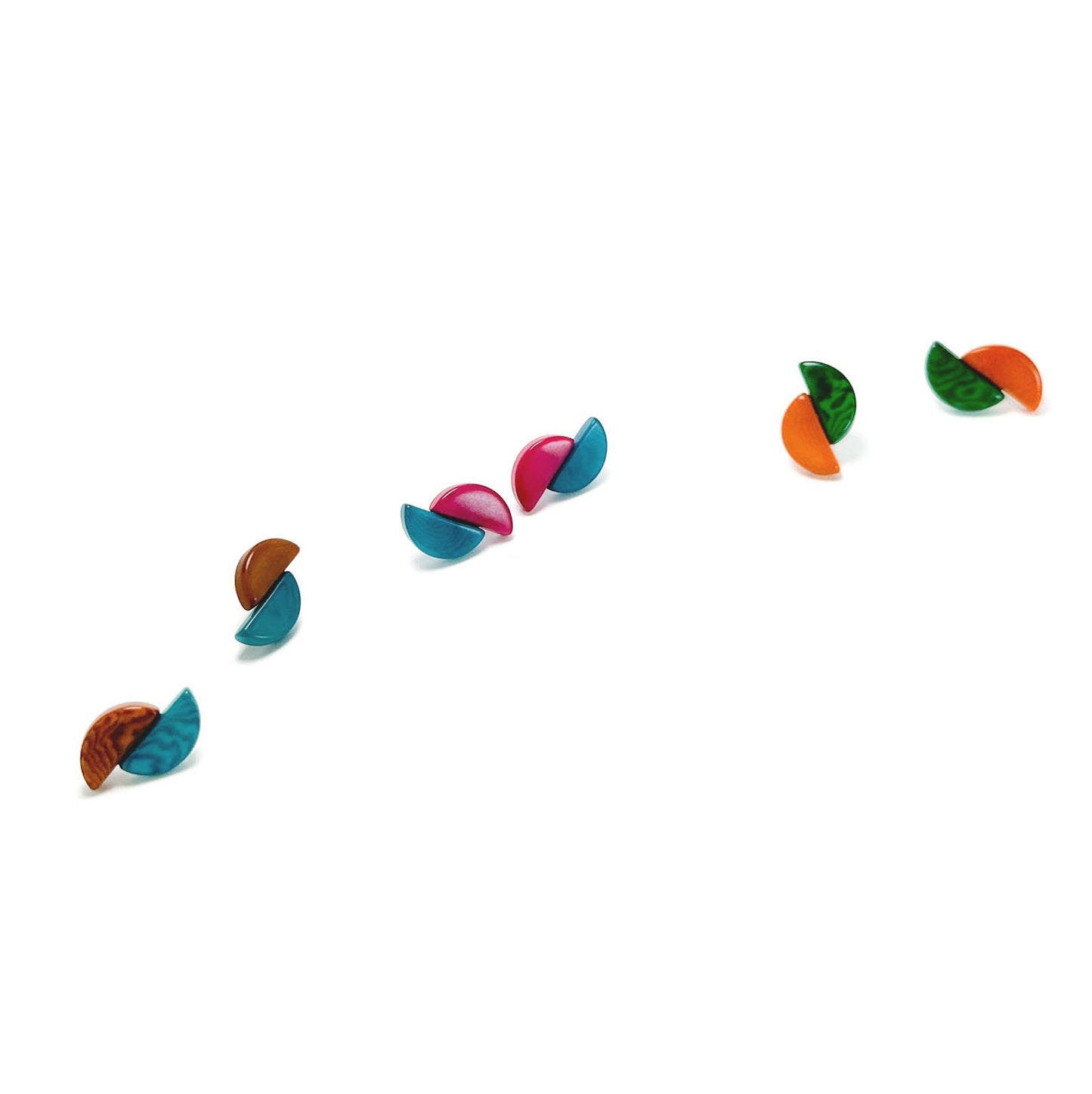 Colorful equinox tagua nut earrings on a white background