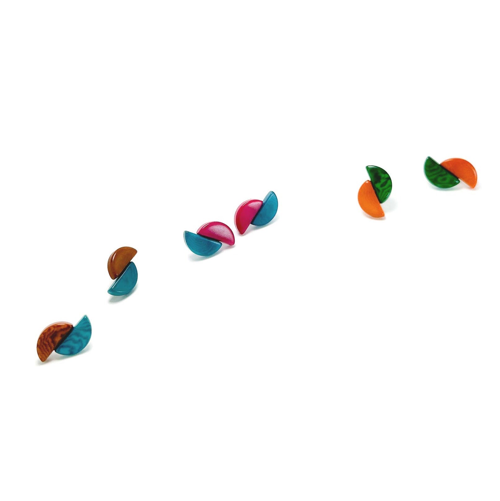 Colorful equinox tagua nut earrings on a white background