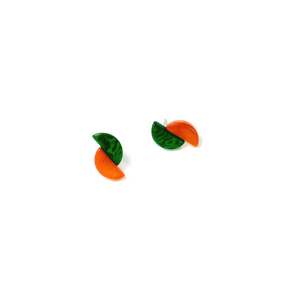 Pair of green and orange tagua nut earrings on a white background