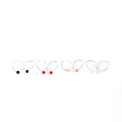 Handmade sterling silver hook earrings with a tagua nut bead