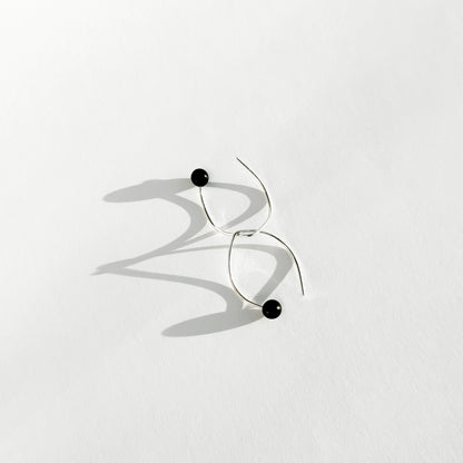 Handmade sterling silver hook earrings with a tagua nut bead