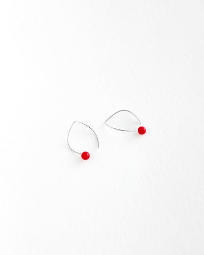 Handmade sterling silver hook earrings with a tagua nut bead