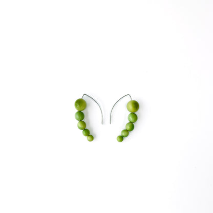 Harmony 5 earrings made of tagua nut spheres threaded into a handmade sterling silver earring hoop