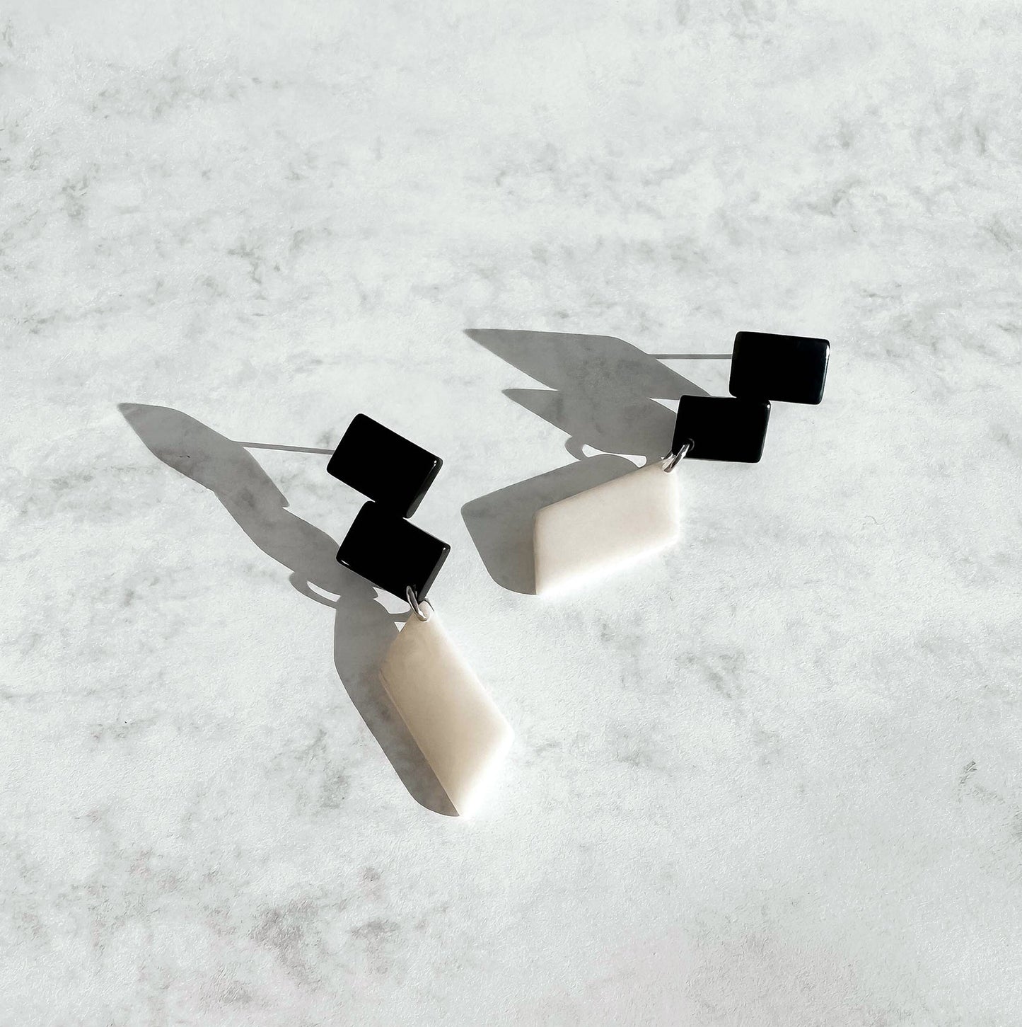 Architectonic and Colourful, long, dangling earrings made with handmade tagua nut beads, inspired by Nasjonal Museet Oslo