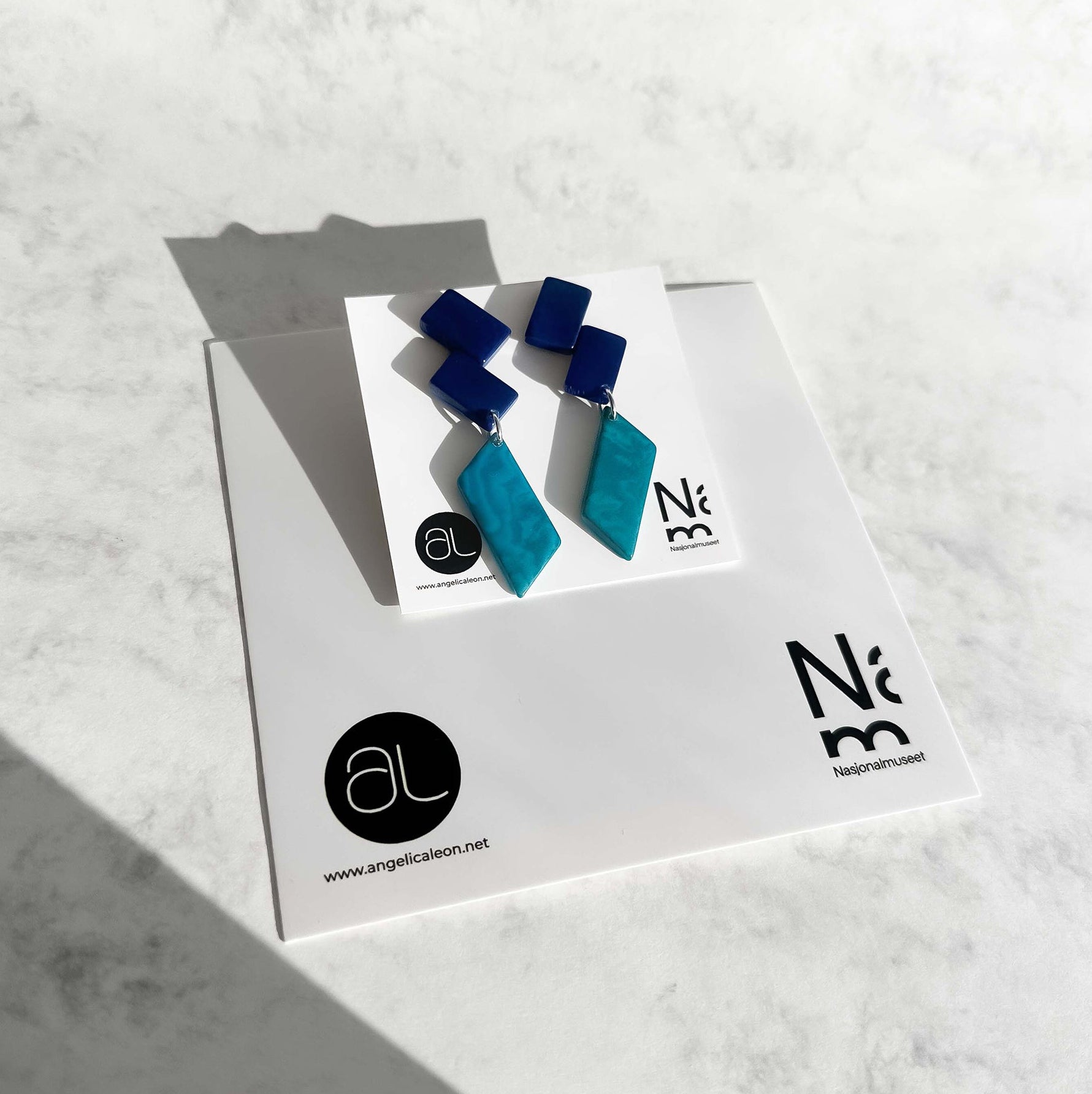 Architectonic and Colourful, long, dangling earrings made with handmade tagua nut beads, inspired by Nasjonal Museet Oslo