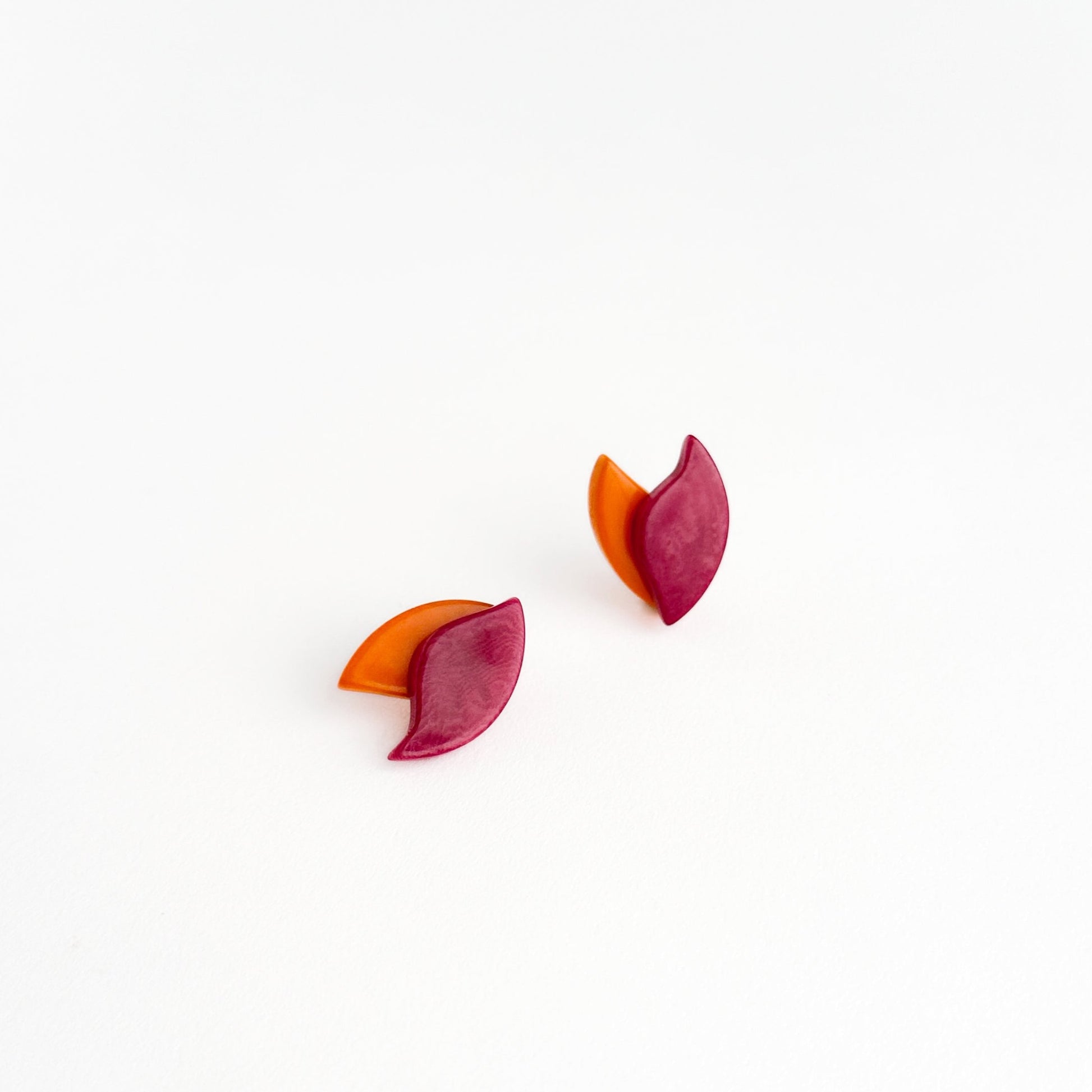 Delicate earrings shape as a lotus flower in contrasting colours