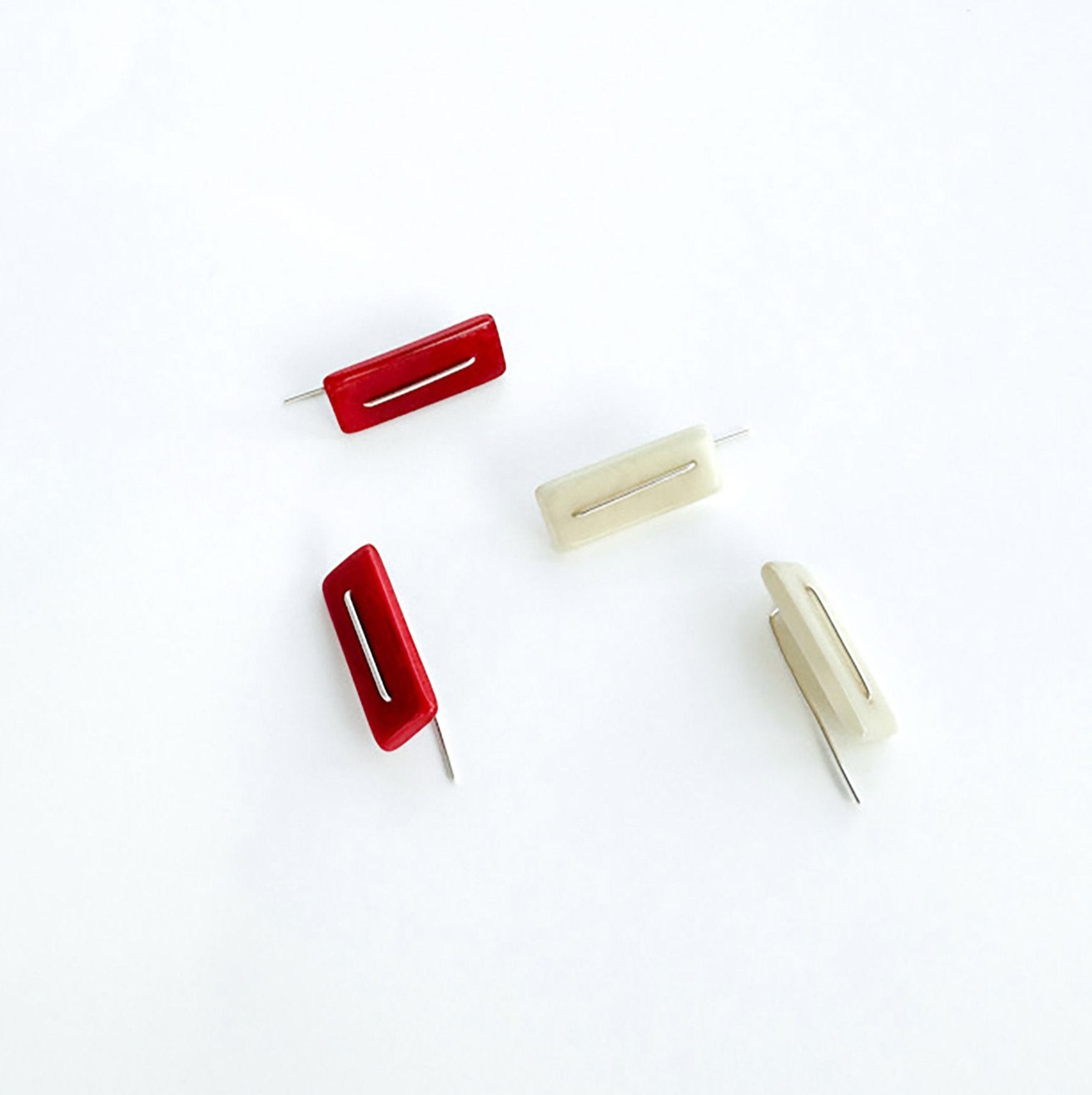 Modern laser cut tagua earrings with a handmade sterling silver hook which is attached without the use of glue.