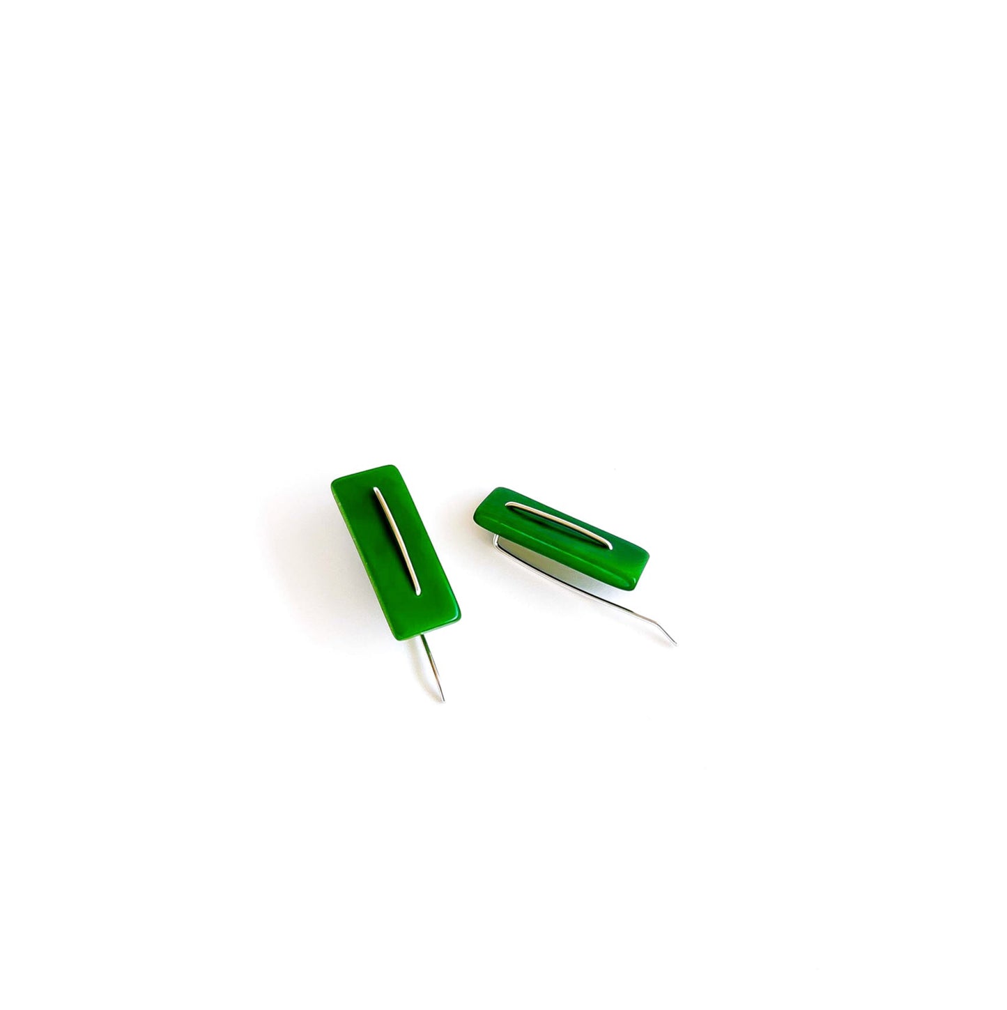 Modern laser cut tagua earrings with a handmade sterling silver hook which is attached without the use of glue.