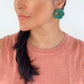 Model wearing Flower shaped earring Bambita in green